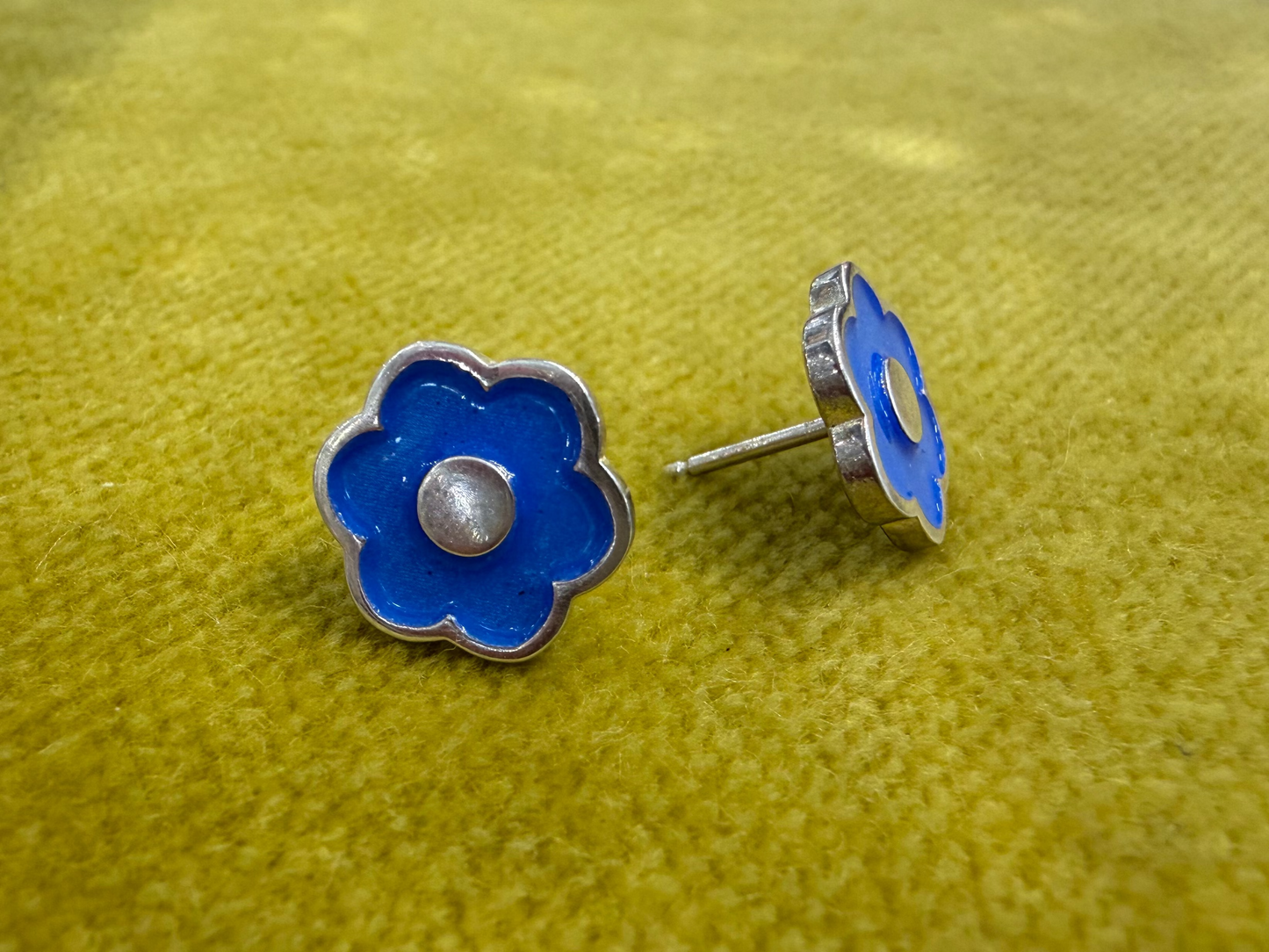 Ellyse Bendillo large flower stud earrings featuring detailed petal design and gold-tone finish.