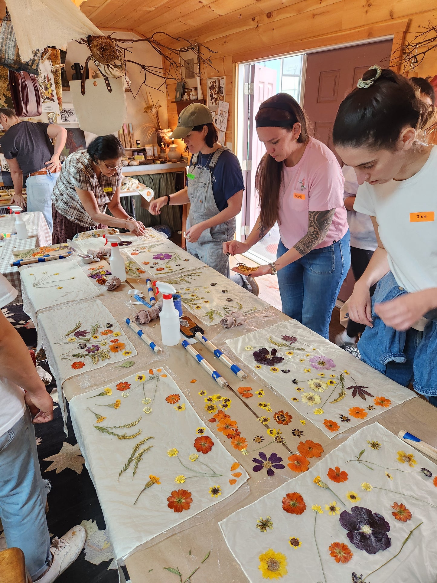 Eco printing and woggle workshop scene featuring participants working on natural dyeing and crafting fabric accessories at Alloy Atelier.