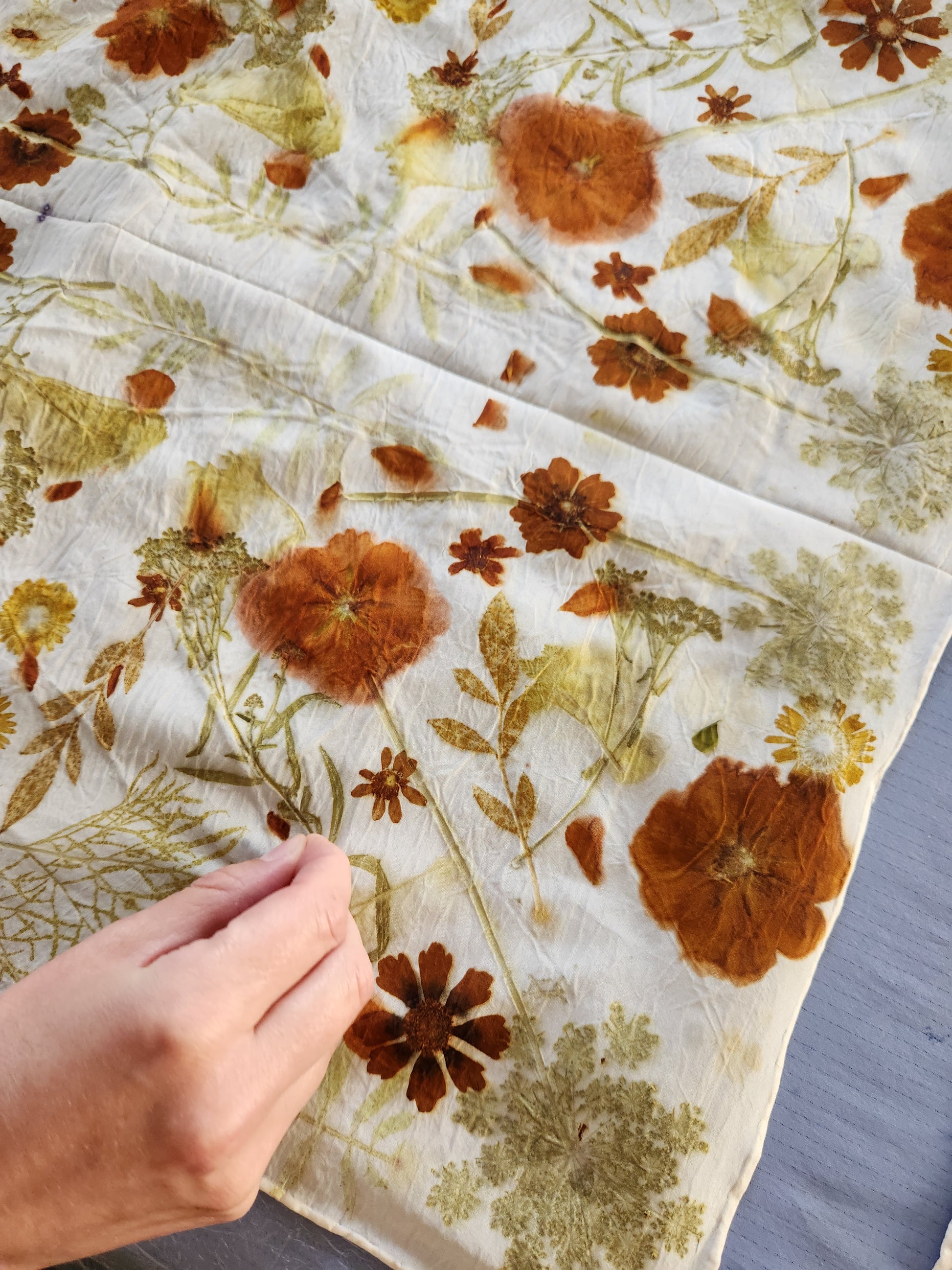 Eco printing and woggle workshop scene with participants creating natural dye patterns and fabric accessories, led by Alloy Atelier.