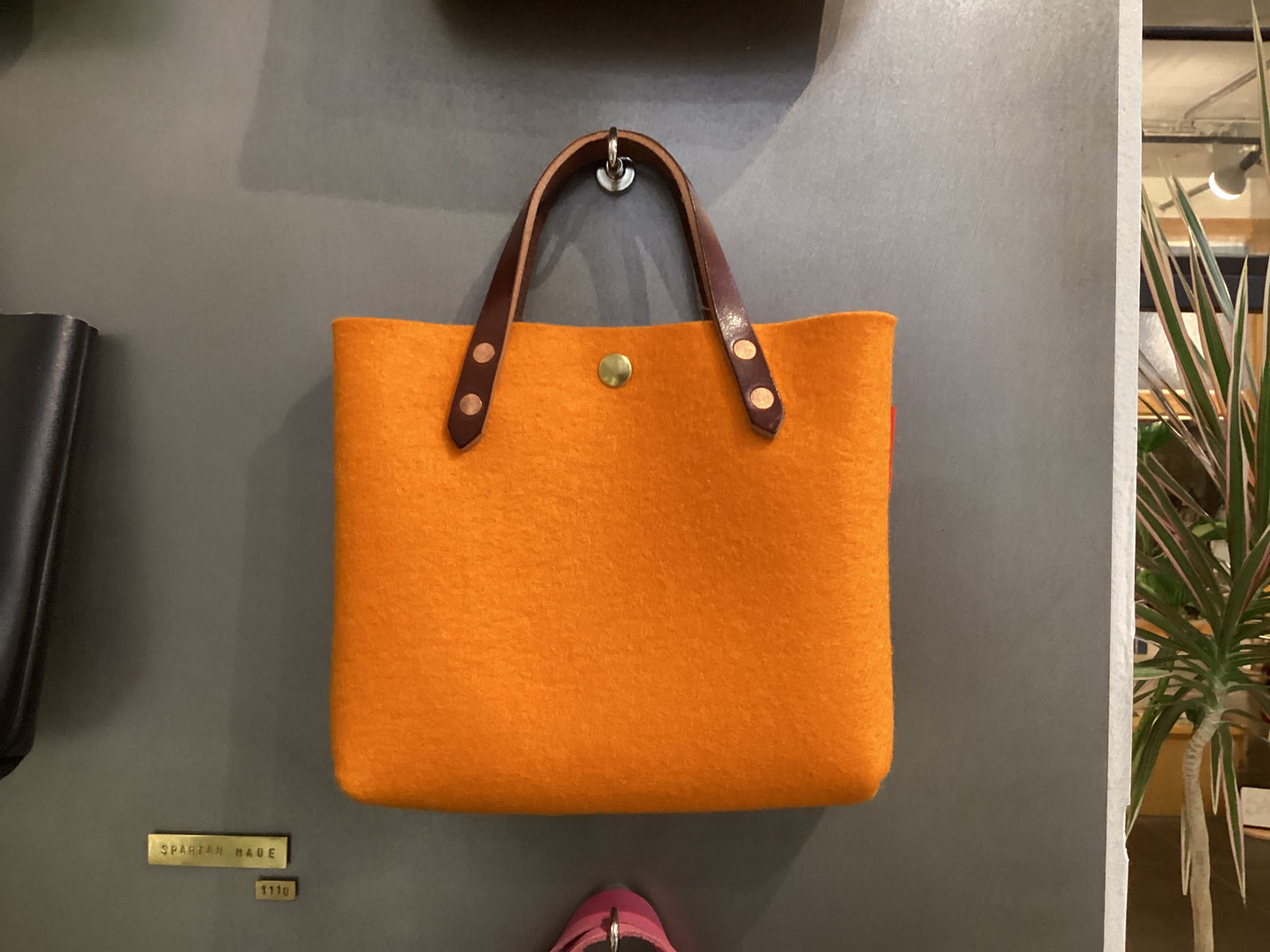 Two-toned felt mini tote bag by Spartan Made with short handles and a sleek, modern design.