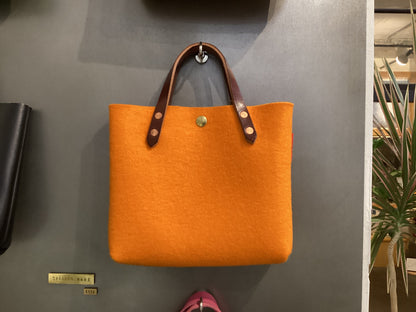Two-toned felt mini tote bag by Spartan Made with short handles and a sleek, modern design.