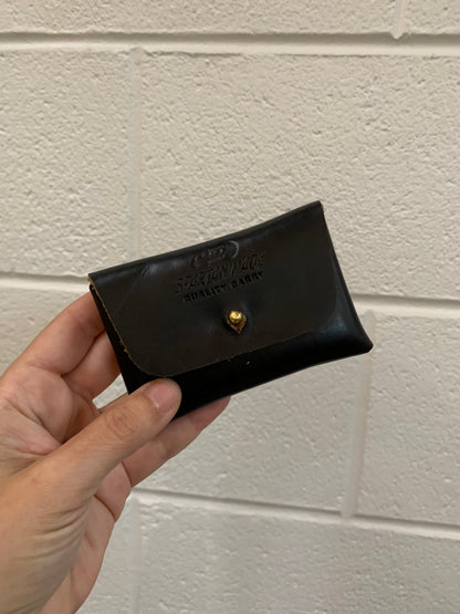 Spartan Made wallet with multiple card slots and a sleek leather design, displayed on a neutral background.