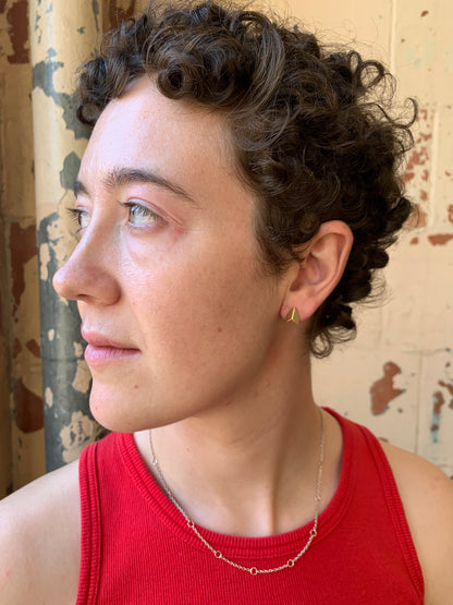 Ellyse Bendillo brass moth wing stud earrings with detailed, natural wing design on a white background.