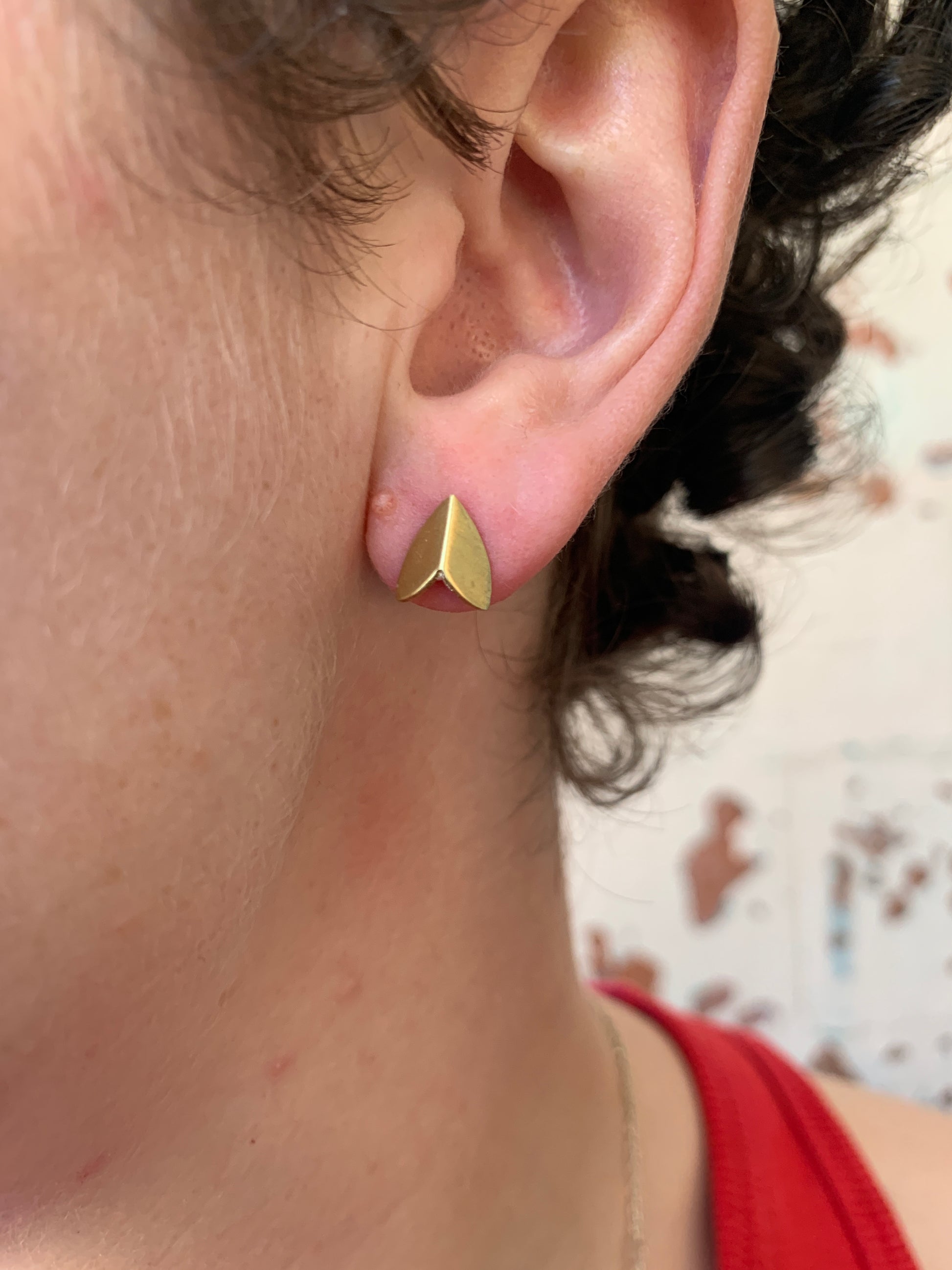 Ellyse Bendillo brass moth wing stud earrings with matte finish, featuring detailed moth wing design on post back jewelry.