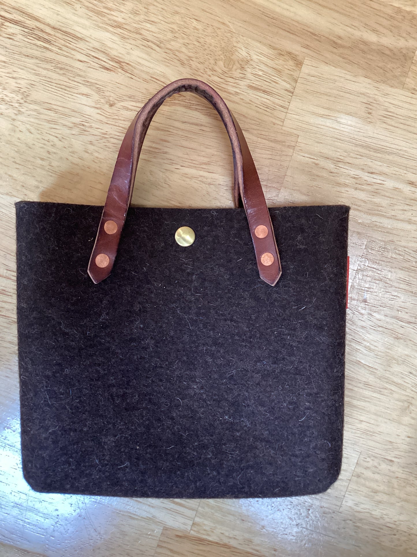 Felt mini tote bag by Spartan Made featuring a compact design and sturdy handles, perfect for everyday use.