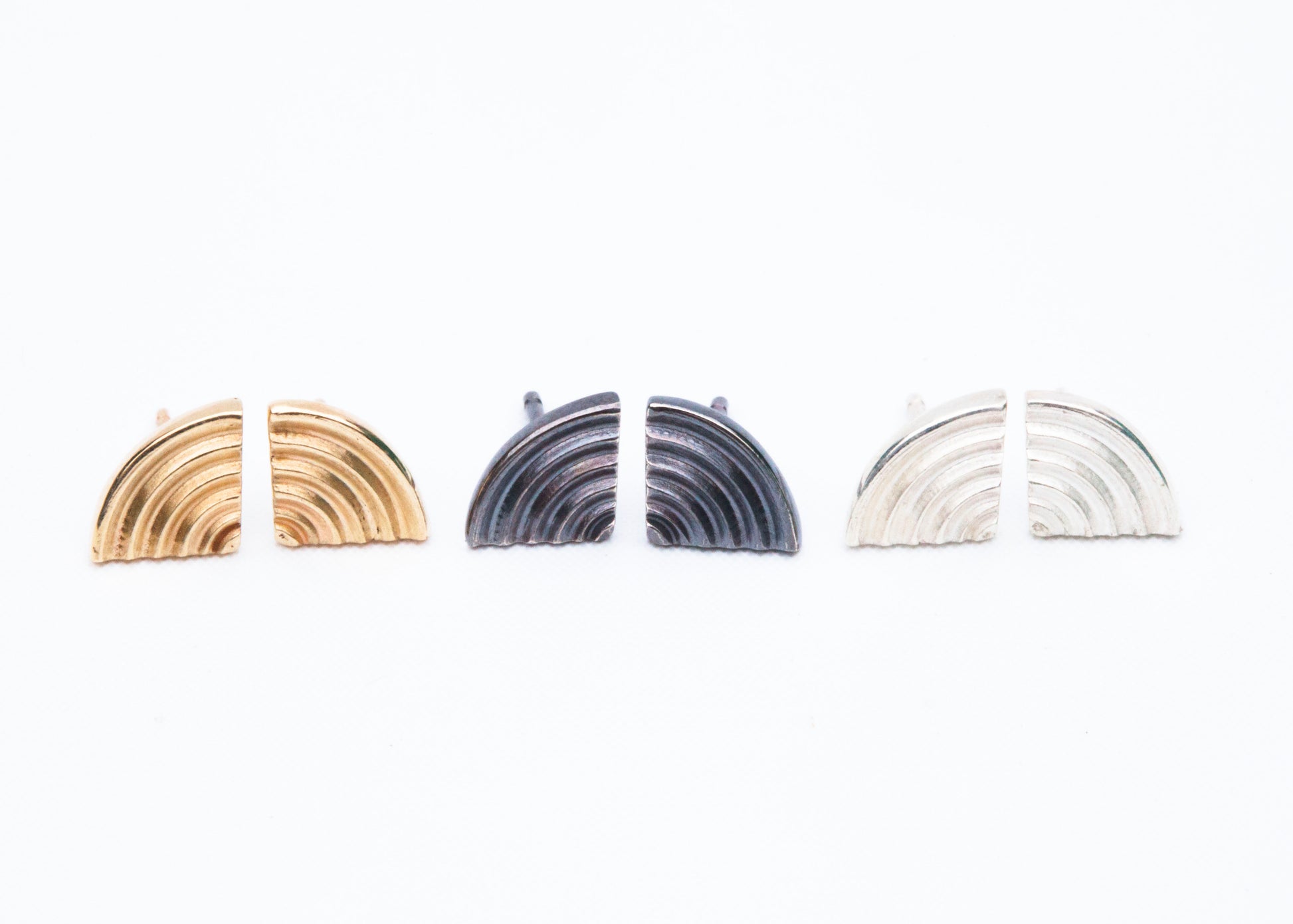 Silver Echo Metals studs earrings featuring sleek, minimalist design on a white background.