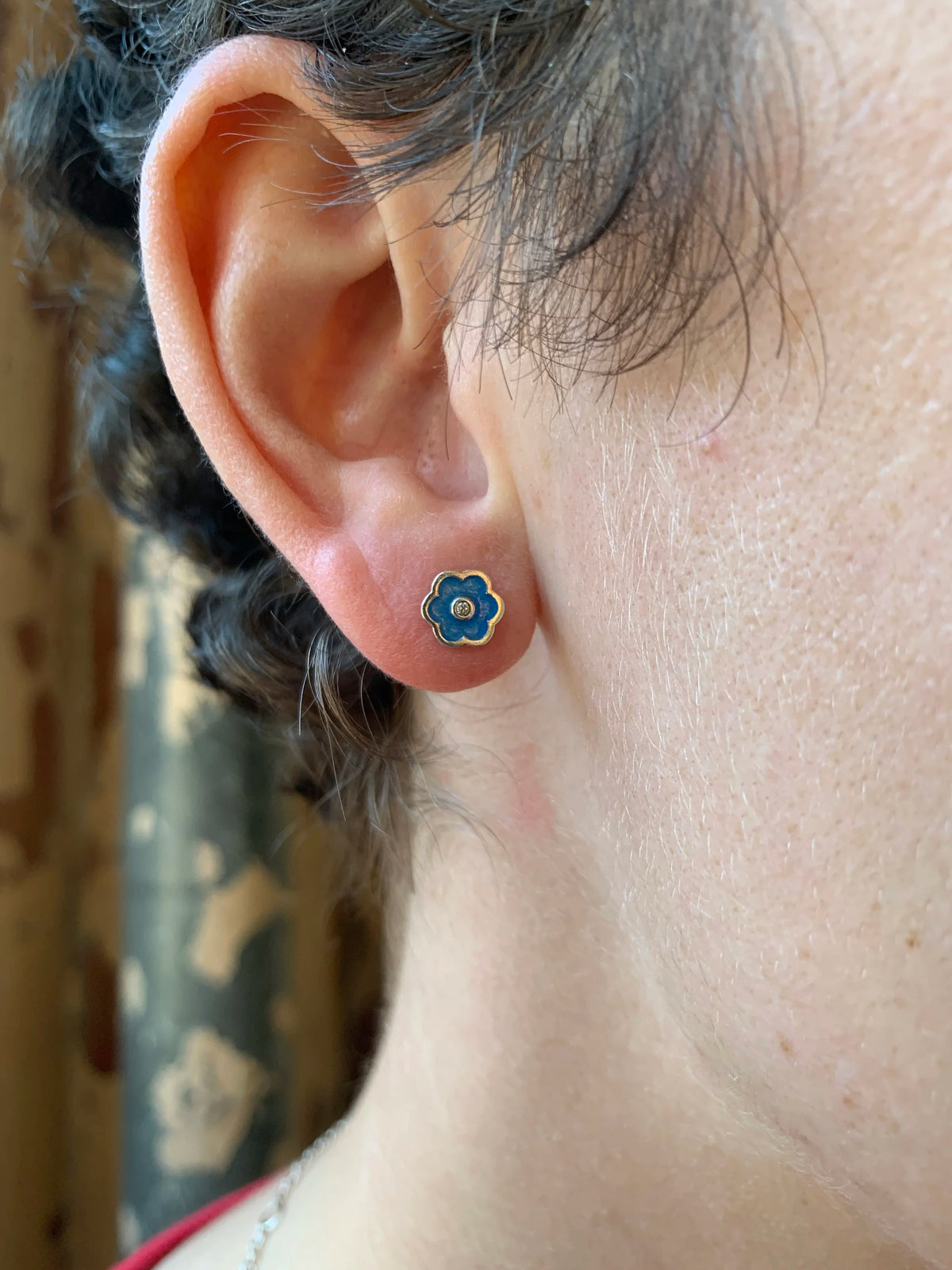 Blue small flower earrings by Ellyse Bendillo, delicate floral stud earrings with detailed petal design.