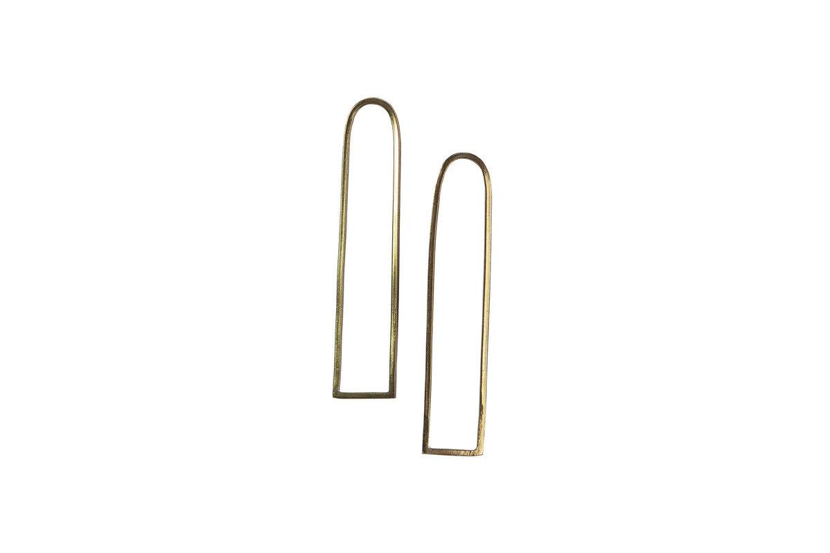Ellyse Bendillo brass window arch studs, featuring a decorative design with a smooth finish, displayed together in a retouched image.