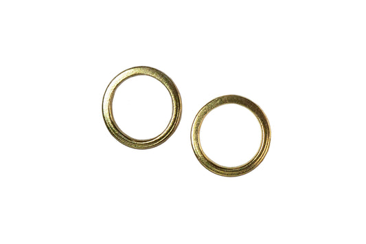Ellyse Bendillo circle stud earrings displayed together, featuring sleek, minimalist design in polished metal with a modern aesthetic.