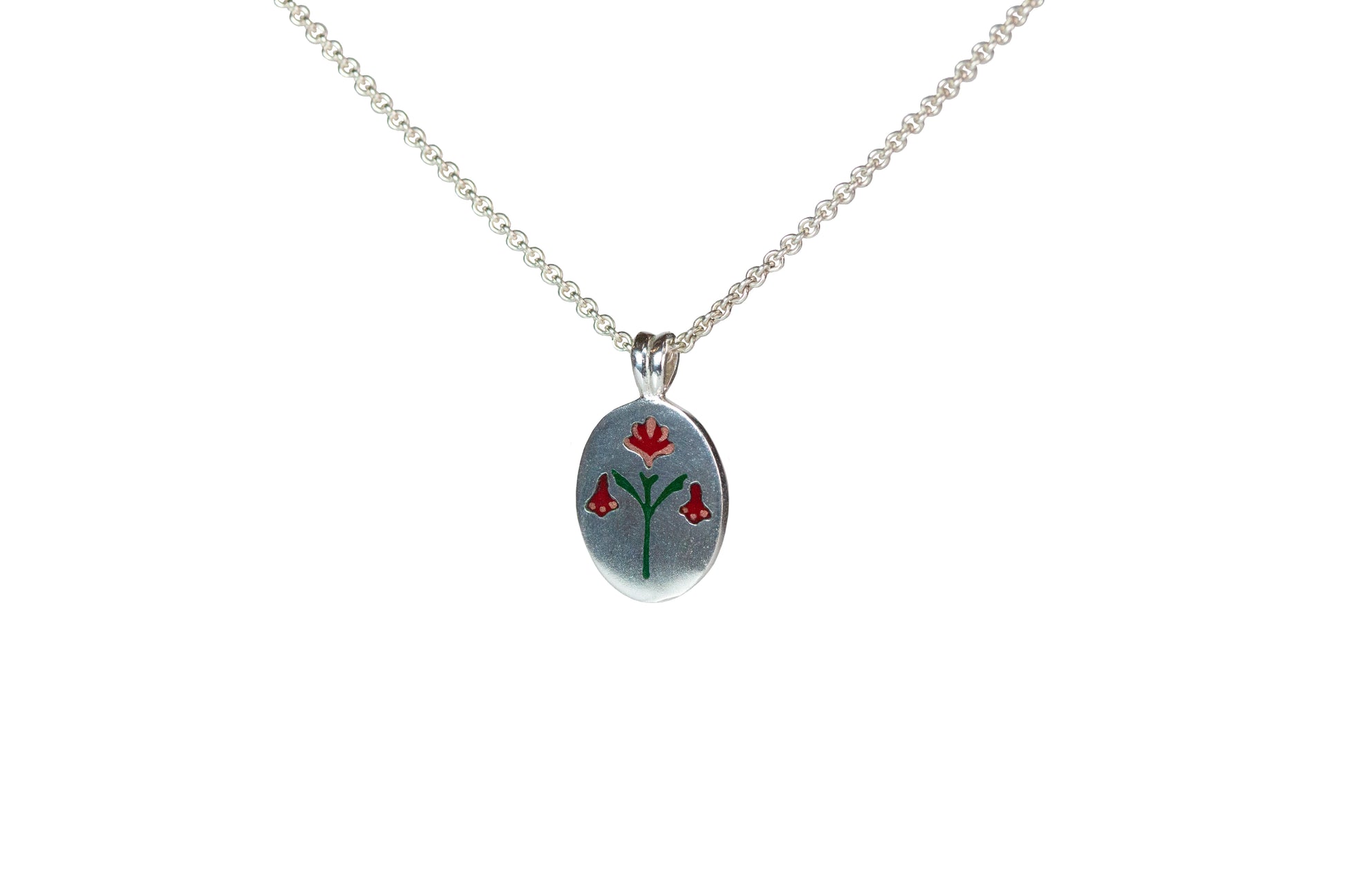Ellyse Bendillo painted house lily pendant necklace with a vibrant red enamel flower design on a chain.