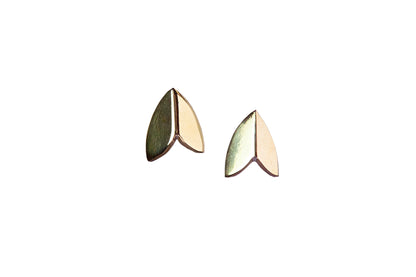 Pair of polished brass moth wing stud earrings by Ellyse Bendillo, showcasing intricate wing details and a shiny finish.