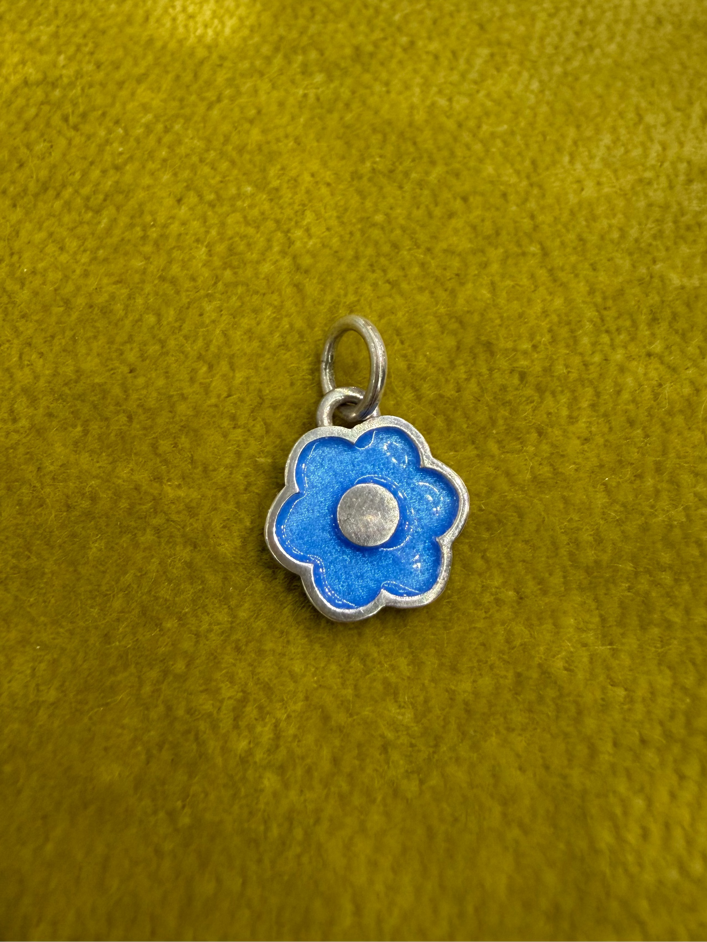Large flower charm by Ellyse Bendillo, close-up of intricate design and vibrant petal details on a charm-only accessory.