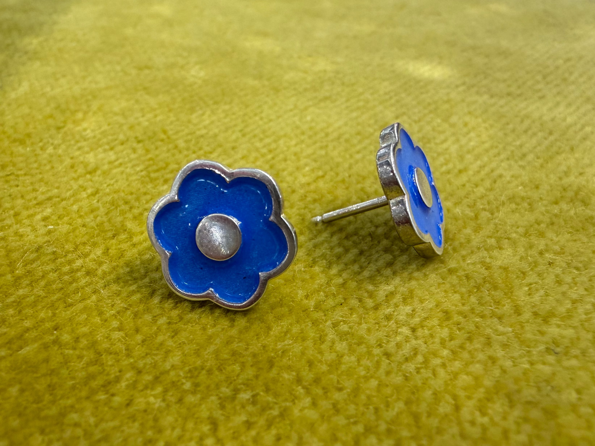 Ellyse Bendillo large flower stud earrings featuring detailed petal design and gold-tone finish.
