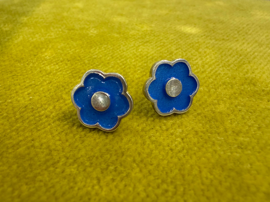 Ellyse Bendillo large flower stud earrings featuring detailed petal designs and silver-tone finish, close-up view.