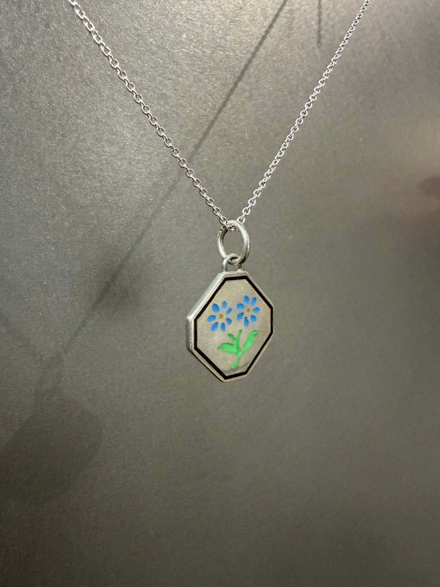 Ellyse Bendillo Floral Duet Charm featuring delicate floral designs on a small, detailed jewelry charm.