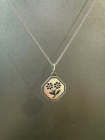 Ellyse Bendillo Floral Duet Charm featuring delicate flower design on a small, elegant charm for jewelry.