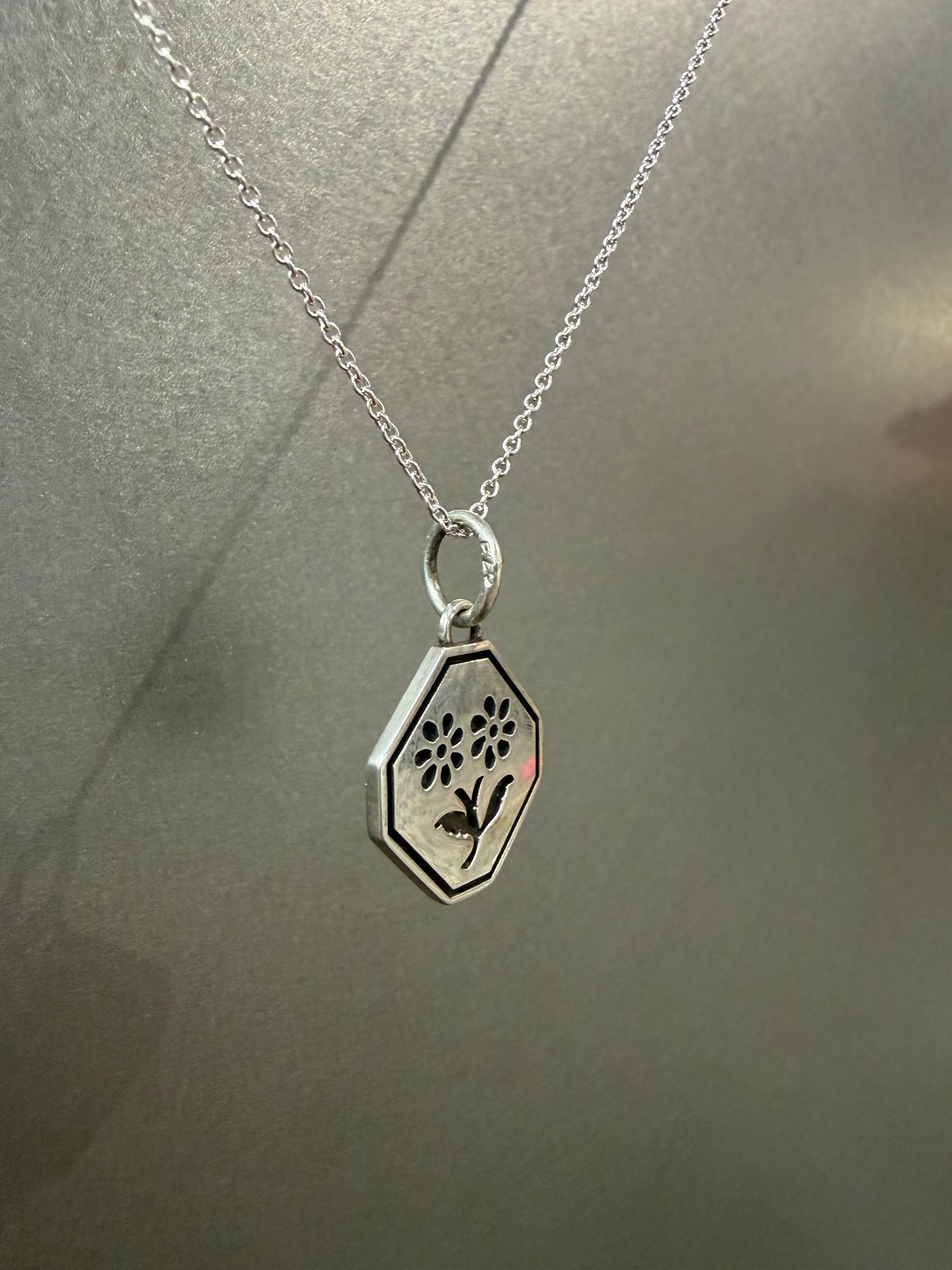 Ellyse Bendillo Floral Duet Charm featuring intricate floral designs, perfect for charm bracelets and jewelry accessories.