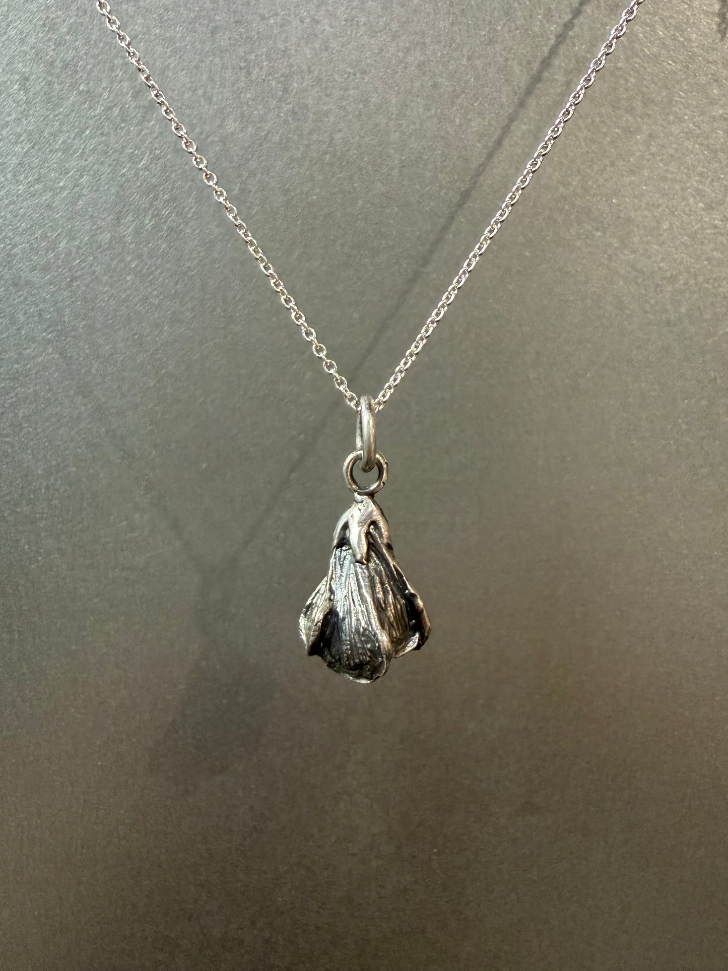 Ellyse Bendillo Magnolia Charm, delicate metal charm with floral design, perfect for jewelry or craft projects.