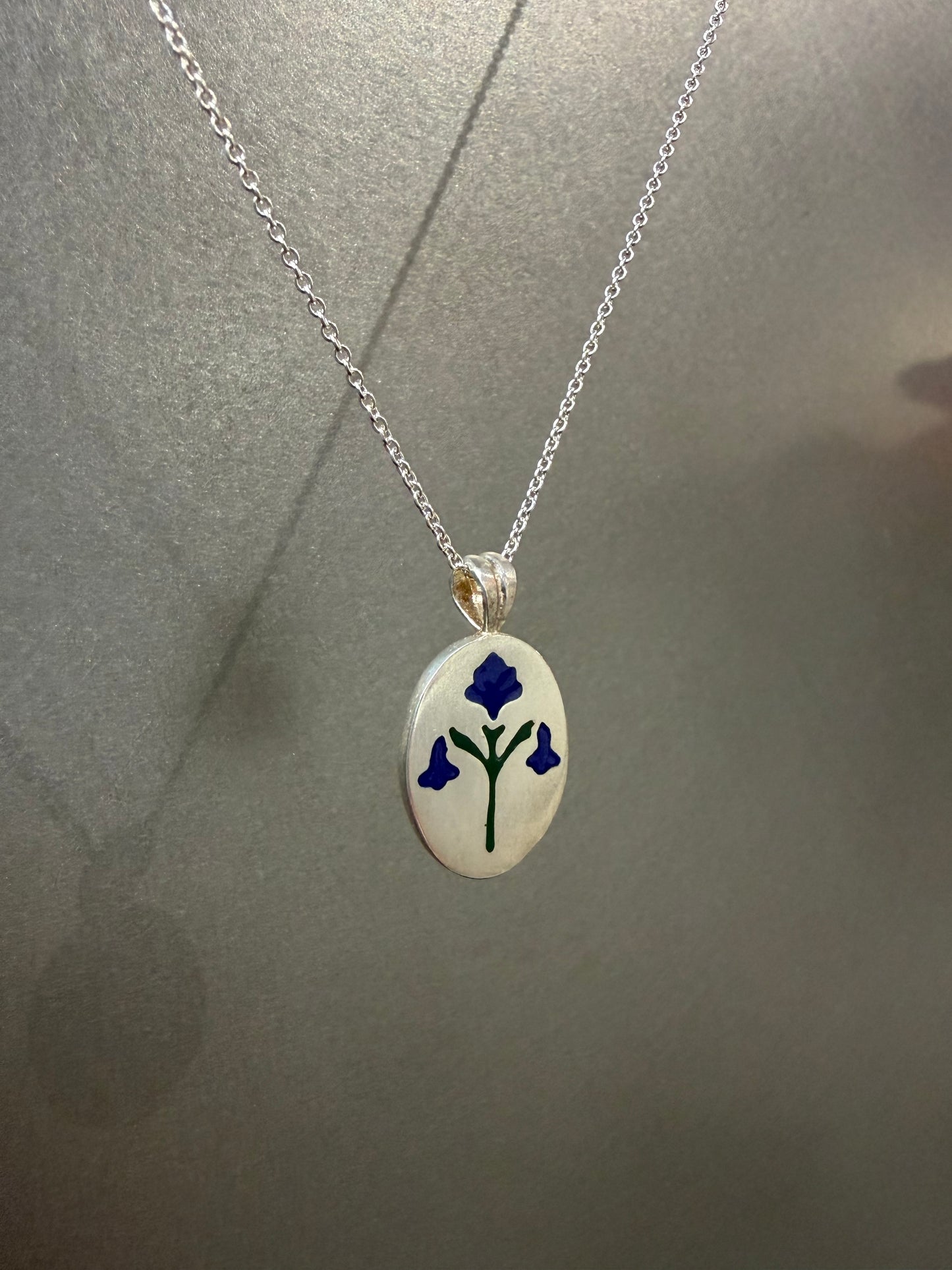 Painted House Lily pendant necklace by Ellyse Bendillo featuring a colorful floral design on a delicate chain.