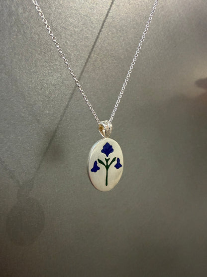 Painted House Lily pendant necklace by Ellyse Bendillo featuring a colorful floral design on a delicate chain.