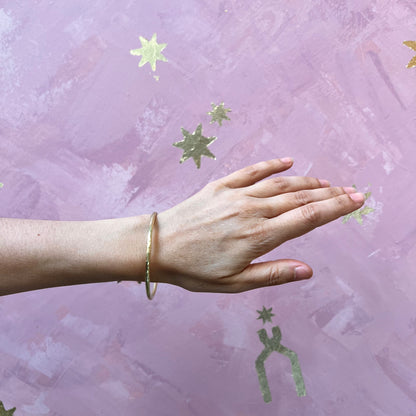 Alloy Atelier bangle bracelet with a sleek, polished silver finish, featuring a modern, minimalist design for stylish accessories.