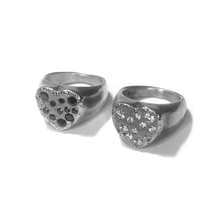 Open book titled "Intro to Carving & Casting" by Alloy Atelier, showcasing detailed diagrams and tools for jewelry making.