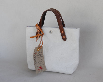 Spartan Made mini canvas tote bag shown from the back, featuring durable fabric and simple design.