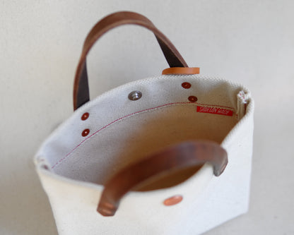 Spartan Made mini tote bag with canvas material, showing the interior design and spacious compartment.