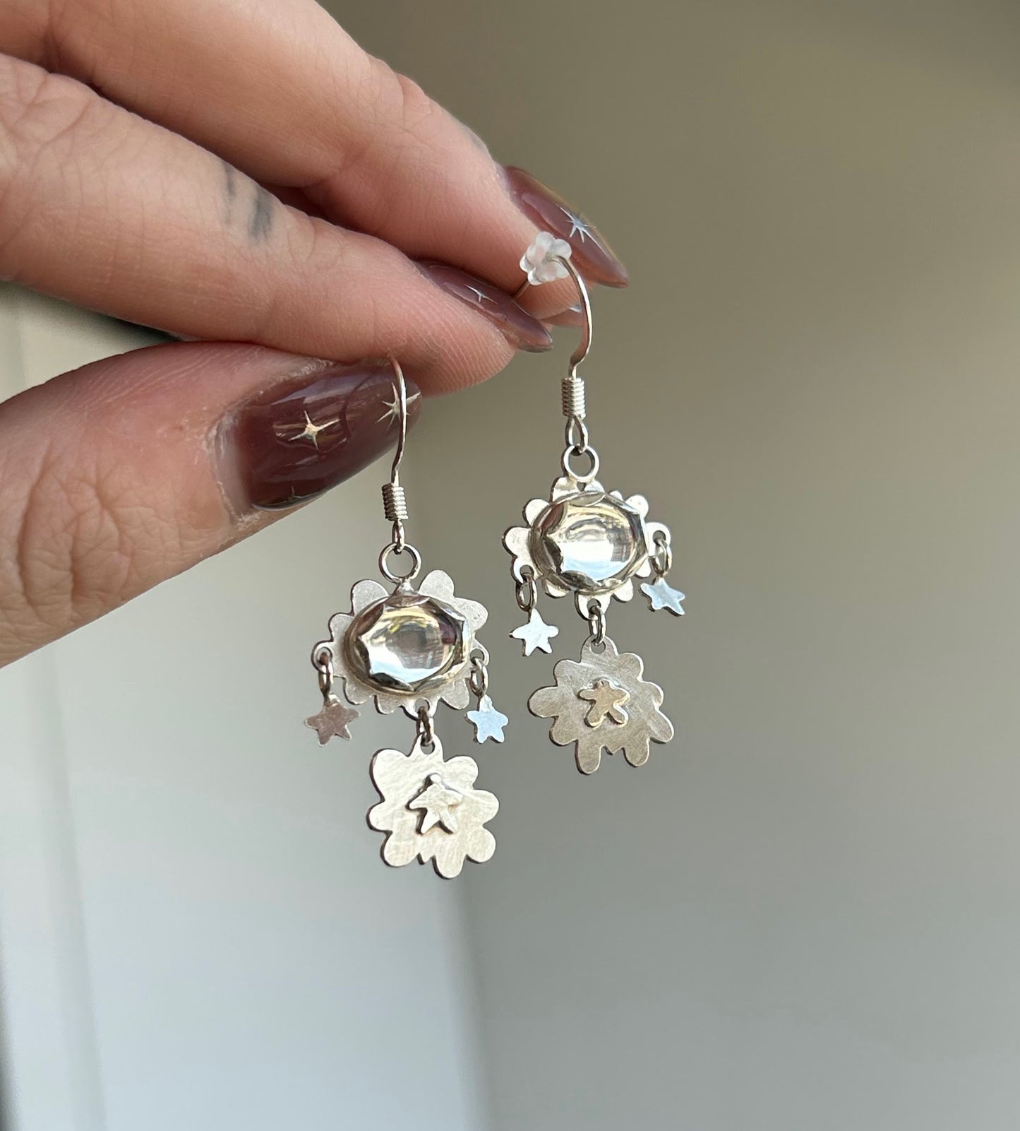 Double cloud earrings by Alloy Atelier from the Oops! All Earrings! collection, featuring silver-toned metal and cloud-shaped design.