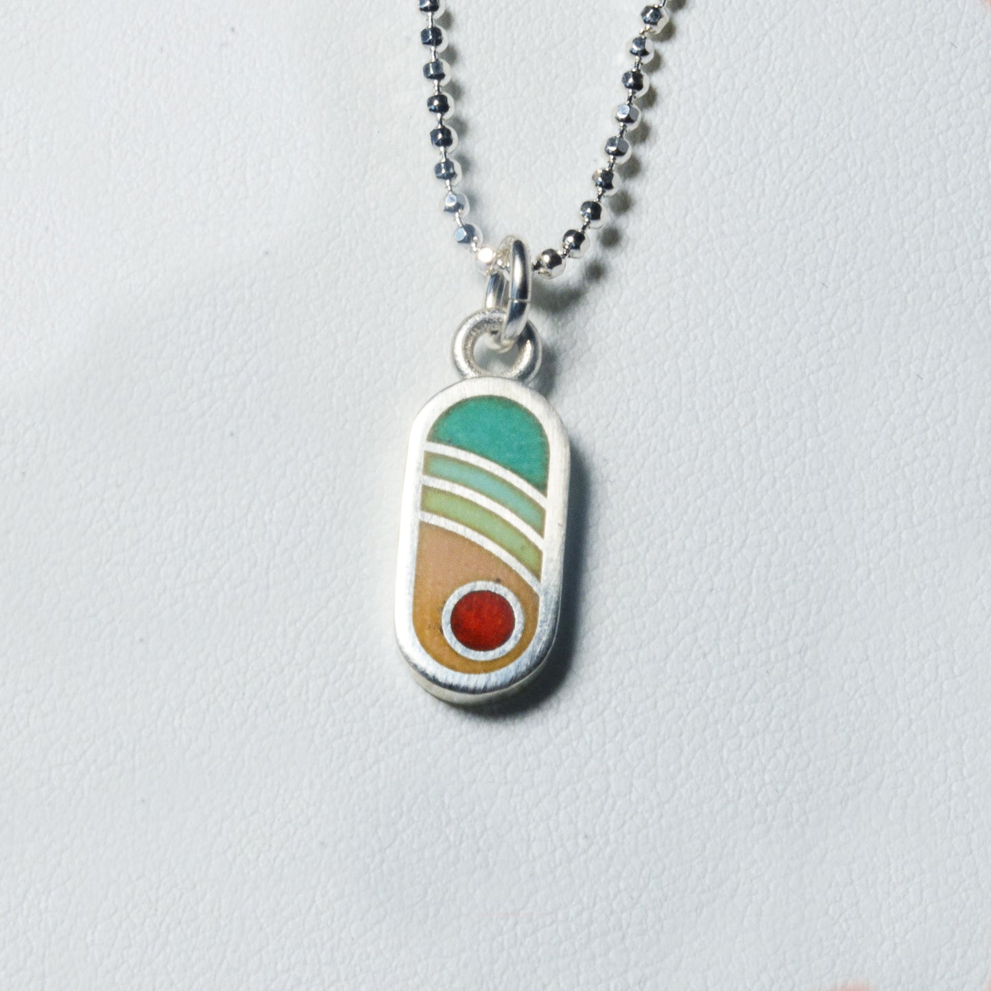 Echo Metals Sunny Charm necklace featuring a small, radiant sun pendant on a delicate chain.