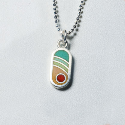 Echo Metals Sunny Charm necklace featuring a small, radiant sun pendant on a delicate chain.