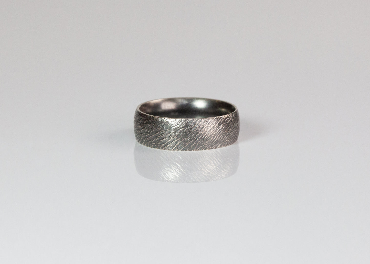 7mm textured band ring by The Tiny Jeweler featuring a sleek, matte finish and modern design.