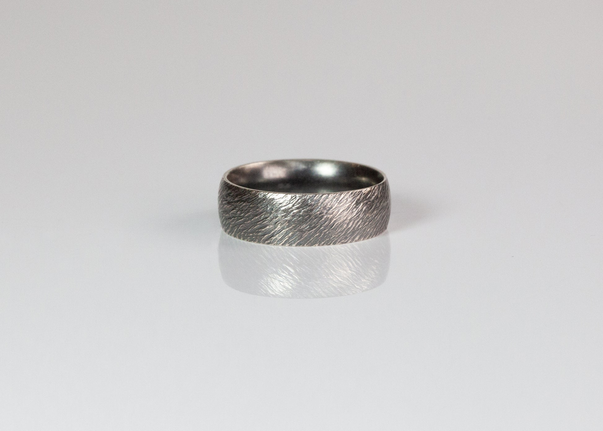7mm textured band ring by The Tiny Jeweler featuring a sleek, matte finish and modern design.