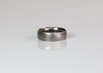 7mm textured band ring by The Tiny Jeweler featuring a sleek, matte finish and modern design.