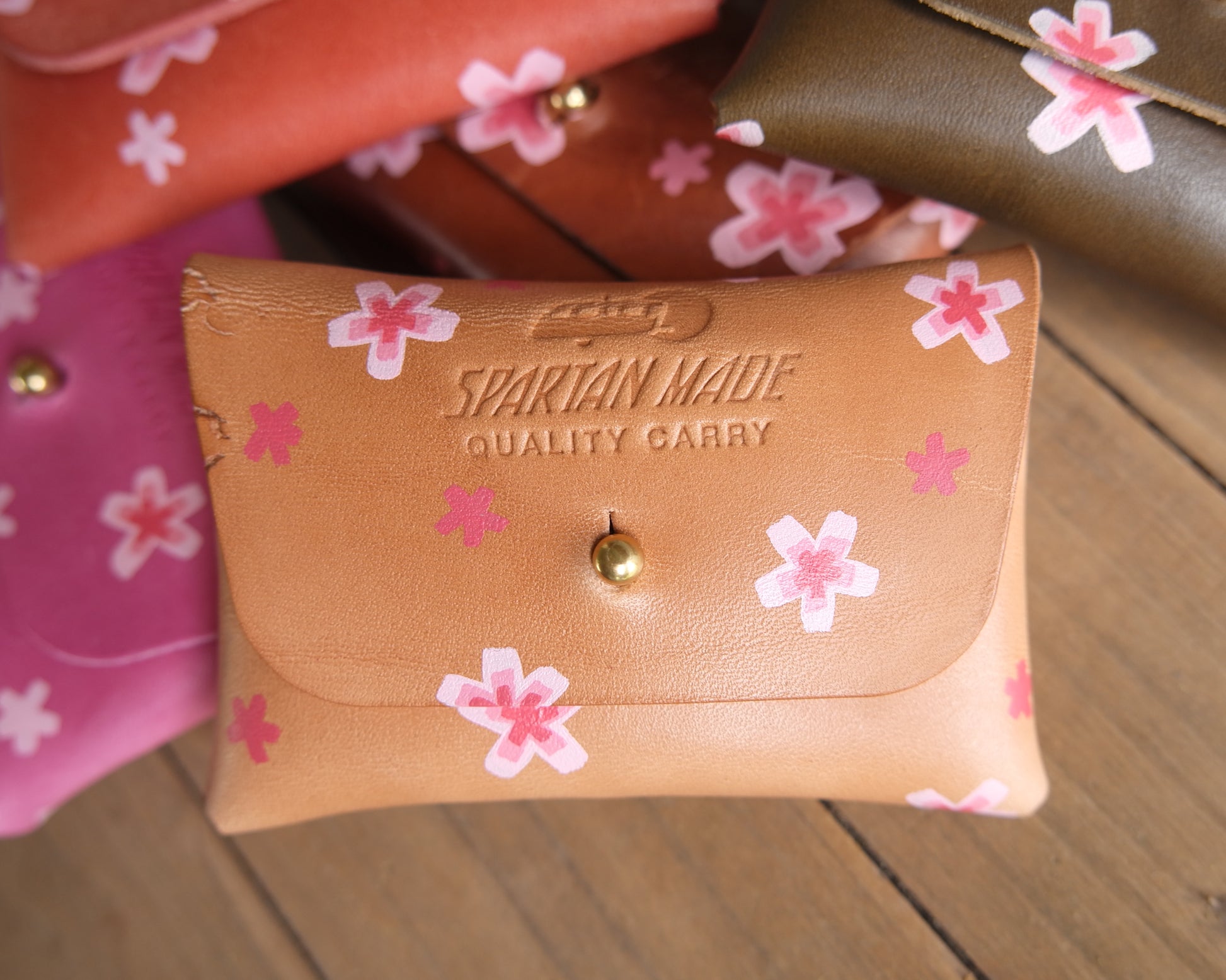 Lightly painted leather Spartan Made wallet with a front view, showcasing its sleek design and craftsmanship.