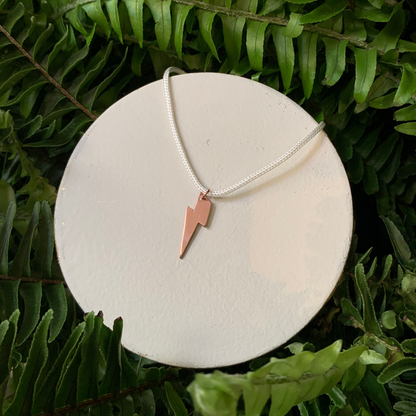 Silver Lightning Charm from Alloy Atelier Workshop, featuring a detailed lightning bolt design for jewelry or accessories.