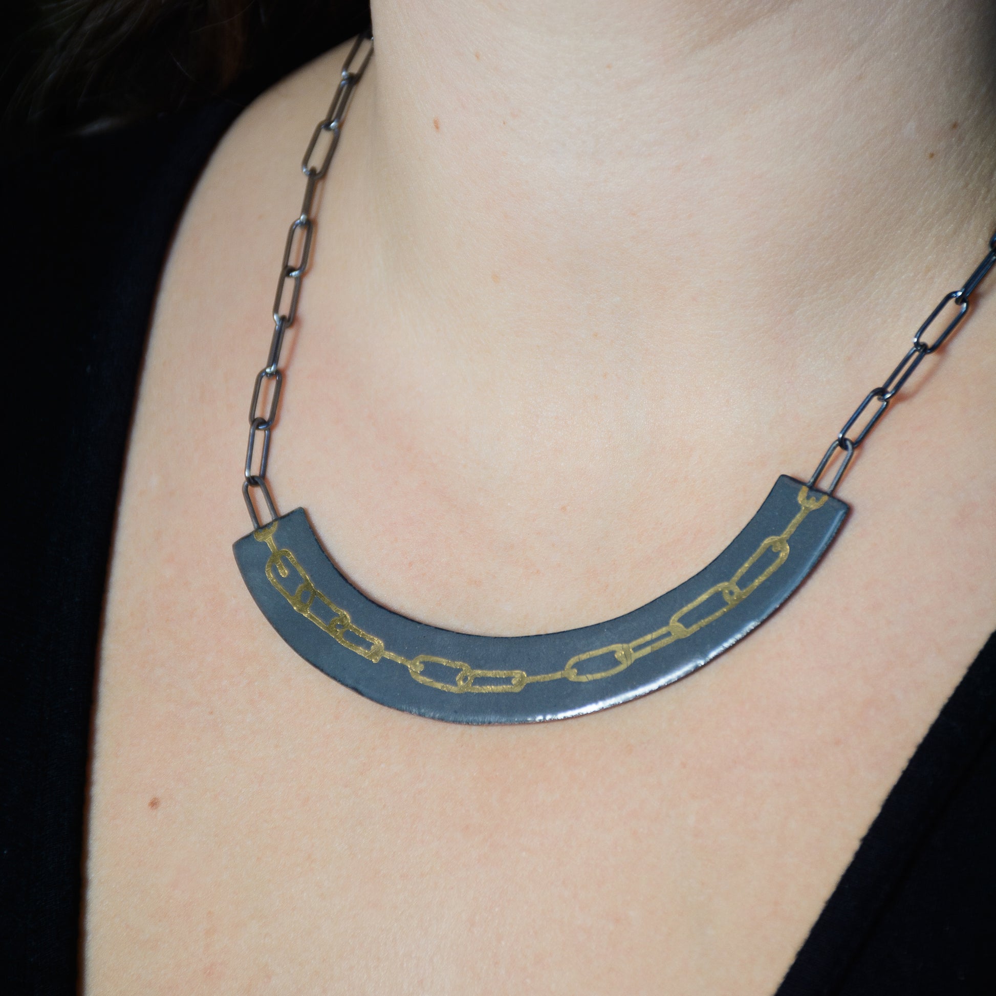 Echo Metals enamel chain necklace with a fixed pendant, showcasing colorful enamel design and delicate metal chain.