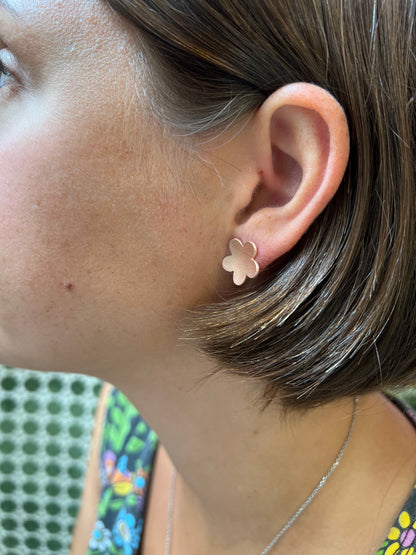 Side view of five-petal stud post earrings by Alloy Atelier, showcasing delicate petal design and polished metal finish.