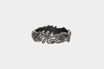 Silver Flora Band ring by The Tiny Jeweler featuring a delicate foliage design in a sleek band style.