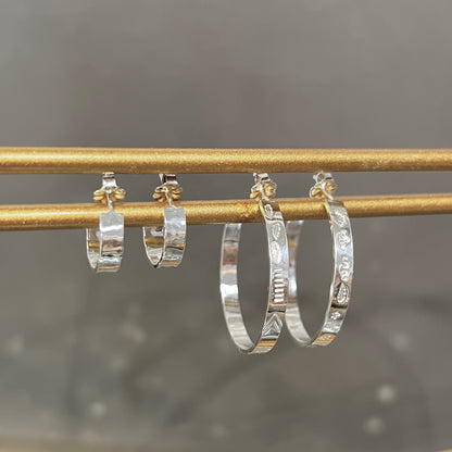 Silver hoop earrings by Alloy Atelier featuring sleek, circular design perfect for everyday wear.