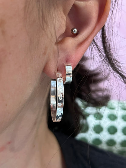 Sterling silver hoop earrings from Alloy Atelier featuring sleek, minimalist design perfect for everyday wear.