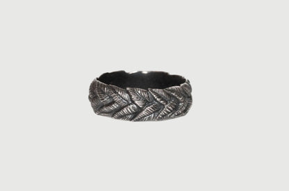 Silver wreath ring created by Alloy Atelier for carving and casting projects, displayed on a web background.